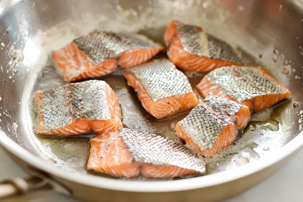 "Frying salmon in a skillet"